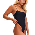 Woman wearing a black swimsuit on a white background