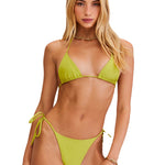 Woman wearing a green bikini set on a white background